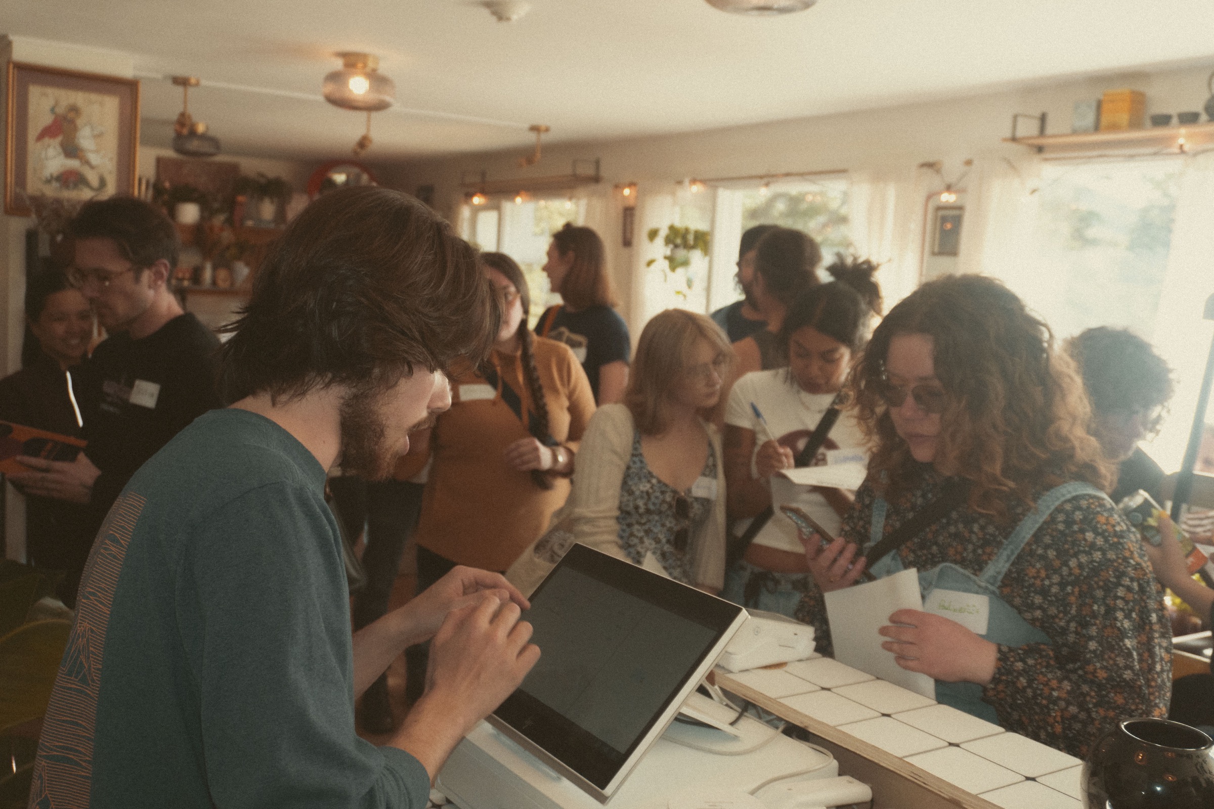 People gathered around the counter at the Oesa Café