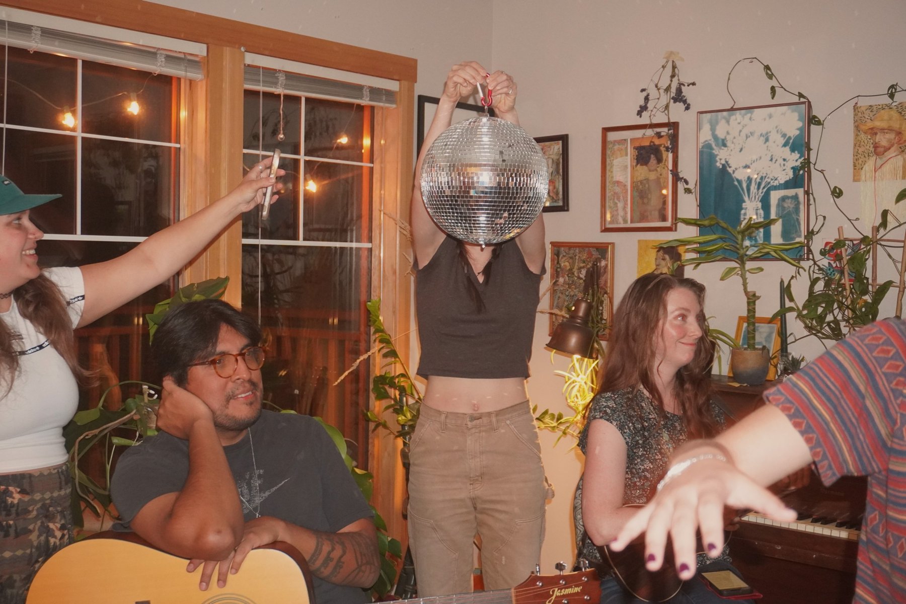 People playing percussion together at a jam night